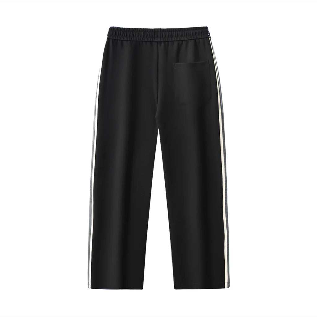 Black pants with white stripes on a white background. NEON American Clothing.