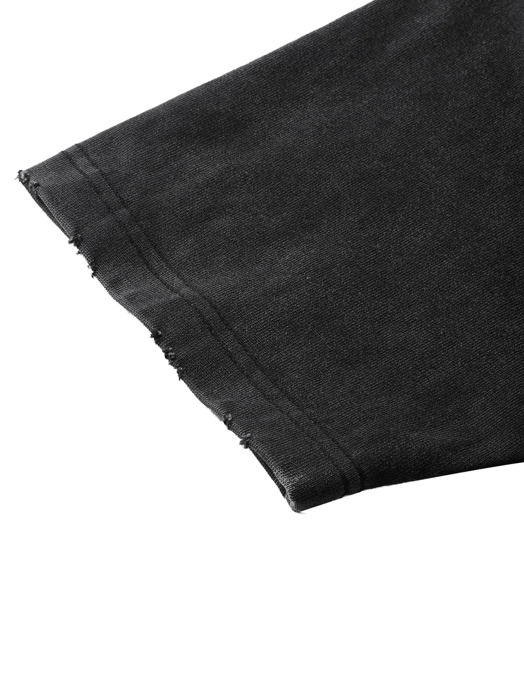 Close-up of black denim fabric with a white background