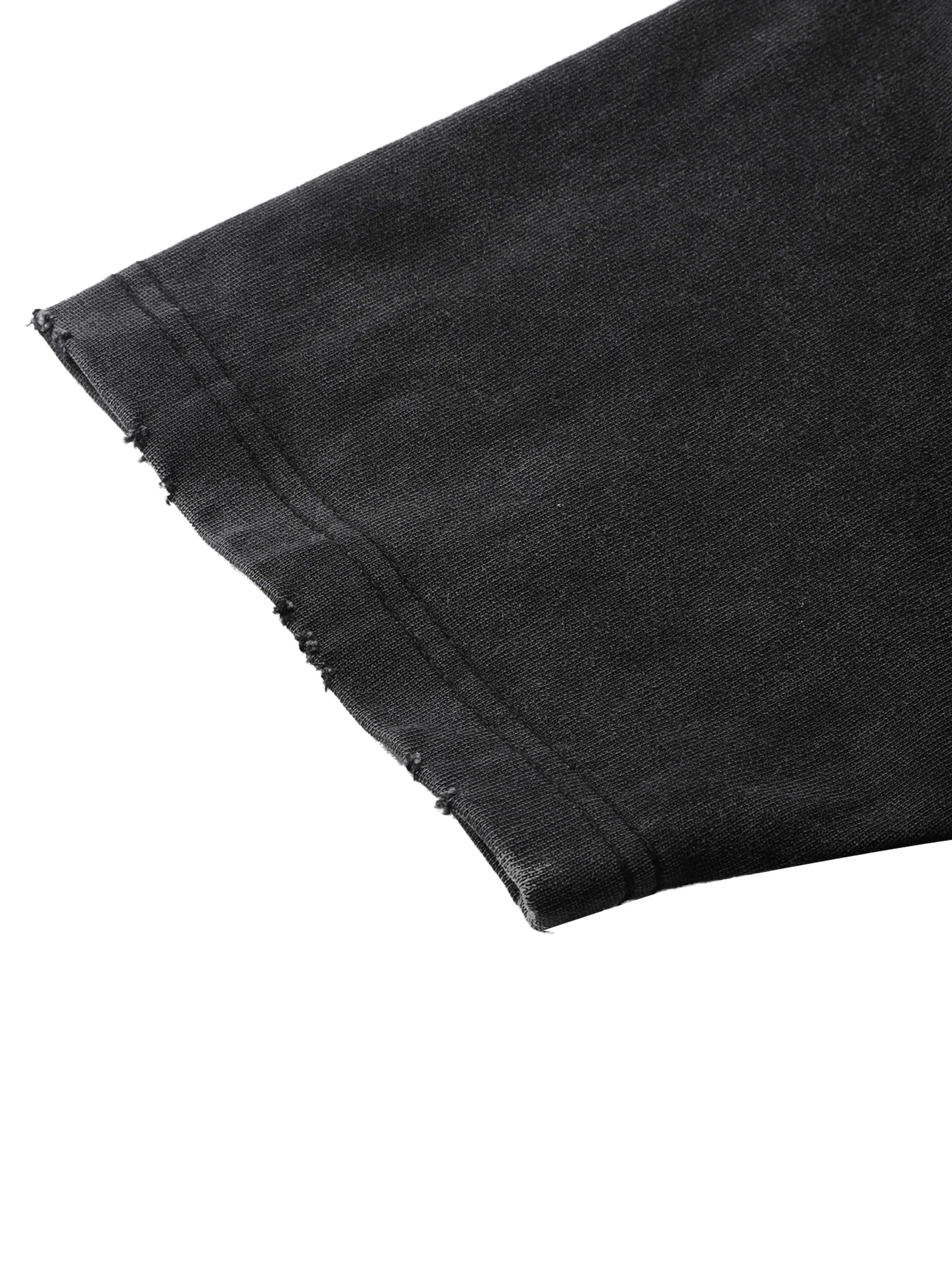 Close-up of black denim fabric with a white background