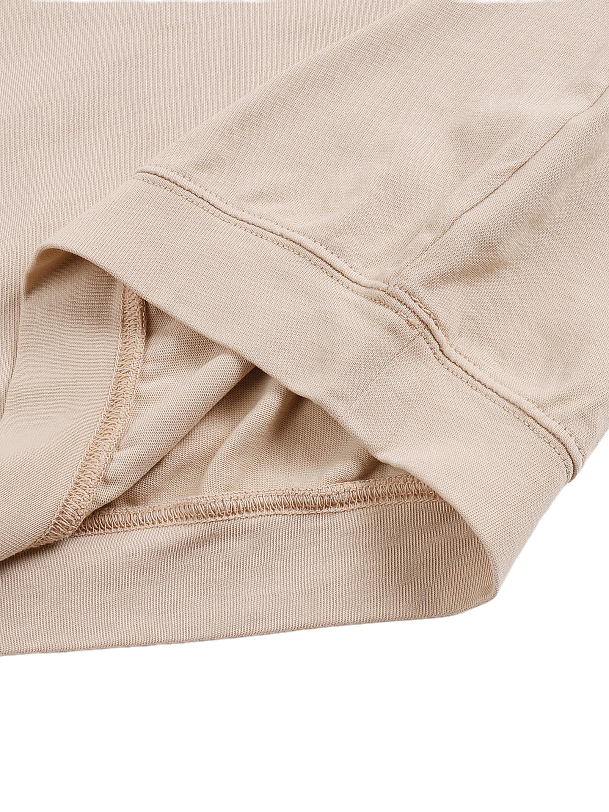 Close-up of beige long sleeve shirt cuff showing stitching and fabric texture